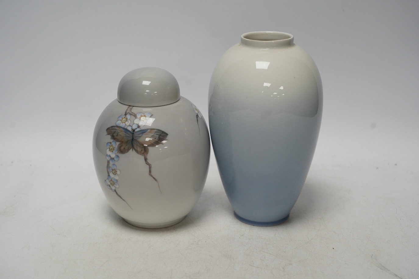 A Royal Copenhagen jar and cover and a similar vase, largest 18cm high. Condition - good